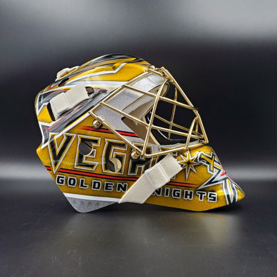 Logan Thompson goalie mask with 24k Pure Gold-plated Fleury Grill