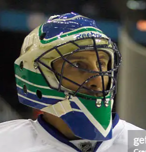 Goalie wearing the mask in a reference photo for Roberto Luongo Signed Goalie Mask 2011 Vancouver Signature Edition Tribute. Goalie Mask Collector.