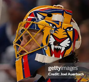 Goalie wearing the mask in a reference photo for Roberto Luongo Goalie Mask Signed 2015 Florida Signature Edition Tribute. Goalie Mask Collector.