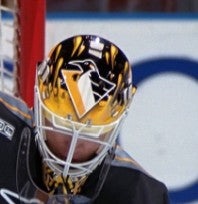 Goalie wearing the mask in a reference photo for Ron Tugnutt Signed Goalie Mask Pittsburgh Signature Edition. Goalie Mask Collector.