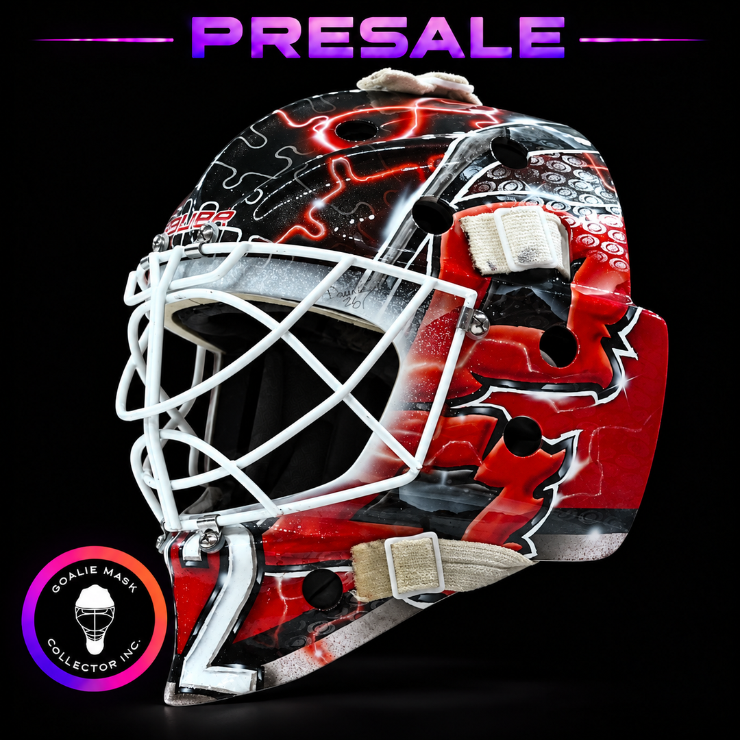 Brandon Bussi Carolina puzzle Signature Edition tribute goalie mask with red, black and silver artwork and white cat eye cage