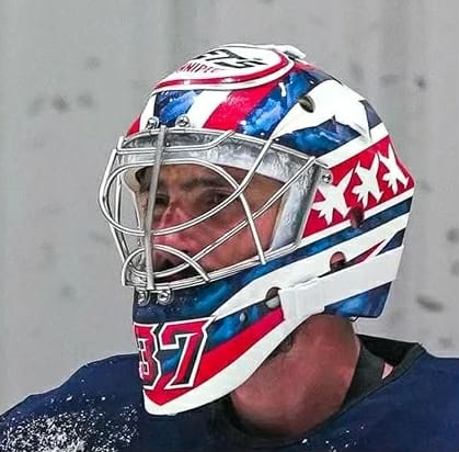 Goalie wearing the mask in a reference photo for Connor Hellebuyck Signed Goalie Mask 2025 26 Winnipeg Heritage Signature Edition. Goalie Mask Collector.