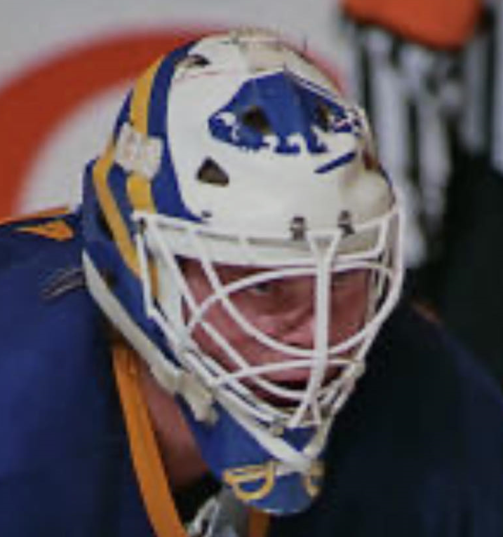 Goalie wearing the mask in a reference photo for Daren Puppa Signed Goalie Mask Buffalo V1 Signature Edition. Goalie Mask Collector.