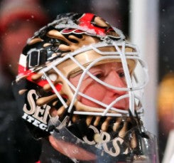 Goalie wearing the mask in a reference photo for Ron Tugnutt Signed Goalie Mask Ottawa Signature Edition. Goalie Mask Collector.