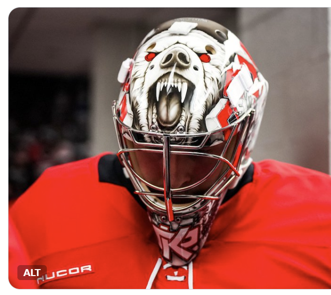 Goalie wearing the mask in a reference photo for Pyotr Kochetkov Signed Goalie Mask 2026 Carolina Signature Edition Tribute. Goalie Mask Collector.
