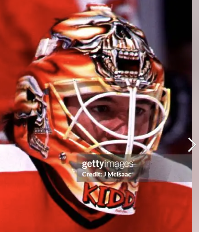 Goalie wearing the mask in a reference photo for Trevor Kidd Signed Goalie Mask Calgary V4 ROBOT SKULL Signature Edition Tribute. Goalie Mask Collector.