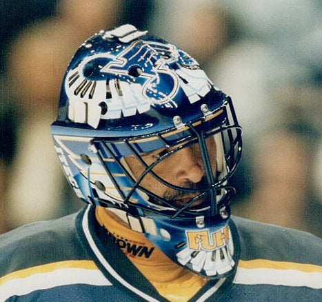 Goalie wearing the mask in a reference photo for Grant Fuhr Signed Goalie Mask St. Louis V3 1999 Signature Edition. Goalie Mask Collector.