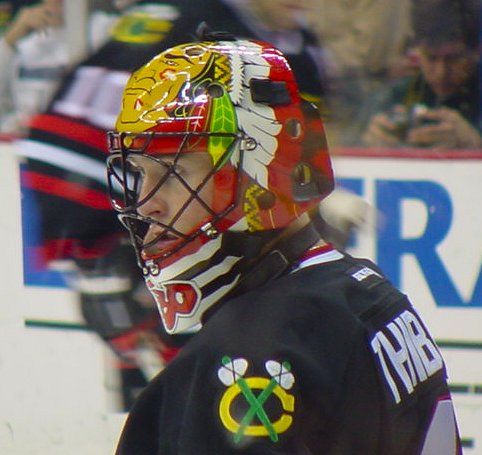 Goalie wearing the mask in a reference photo for Jocelyn Thibault Signed Goalie Mask Chicago Tribute Signature Edition. Goalie Mask Collector.